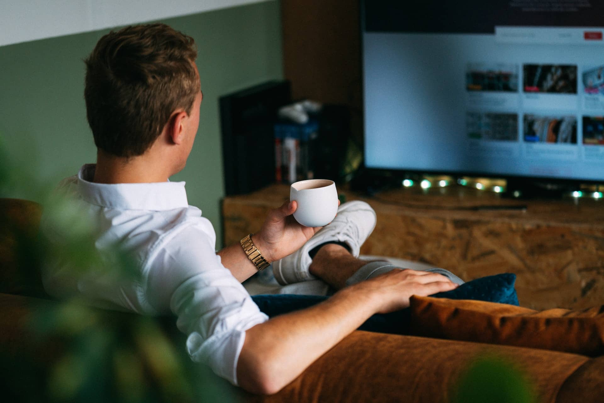 man sitting drinking coffee