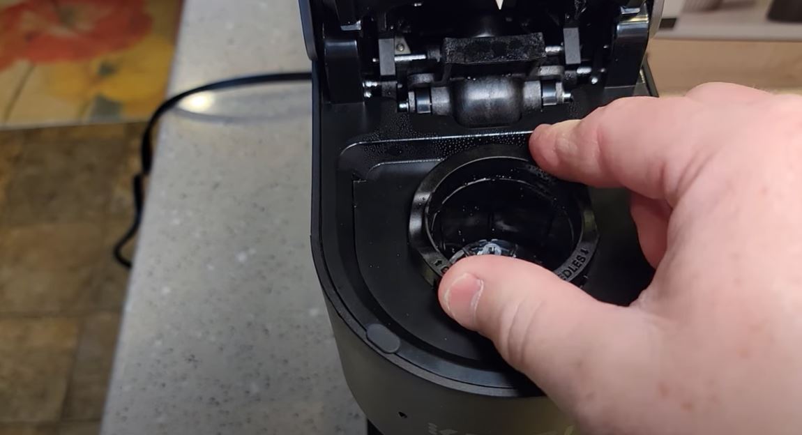 placing keurig k slim basket back into place