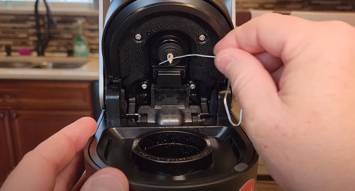 cleaning top needle of keurig k slim back to front