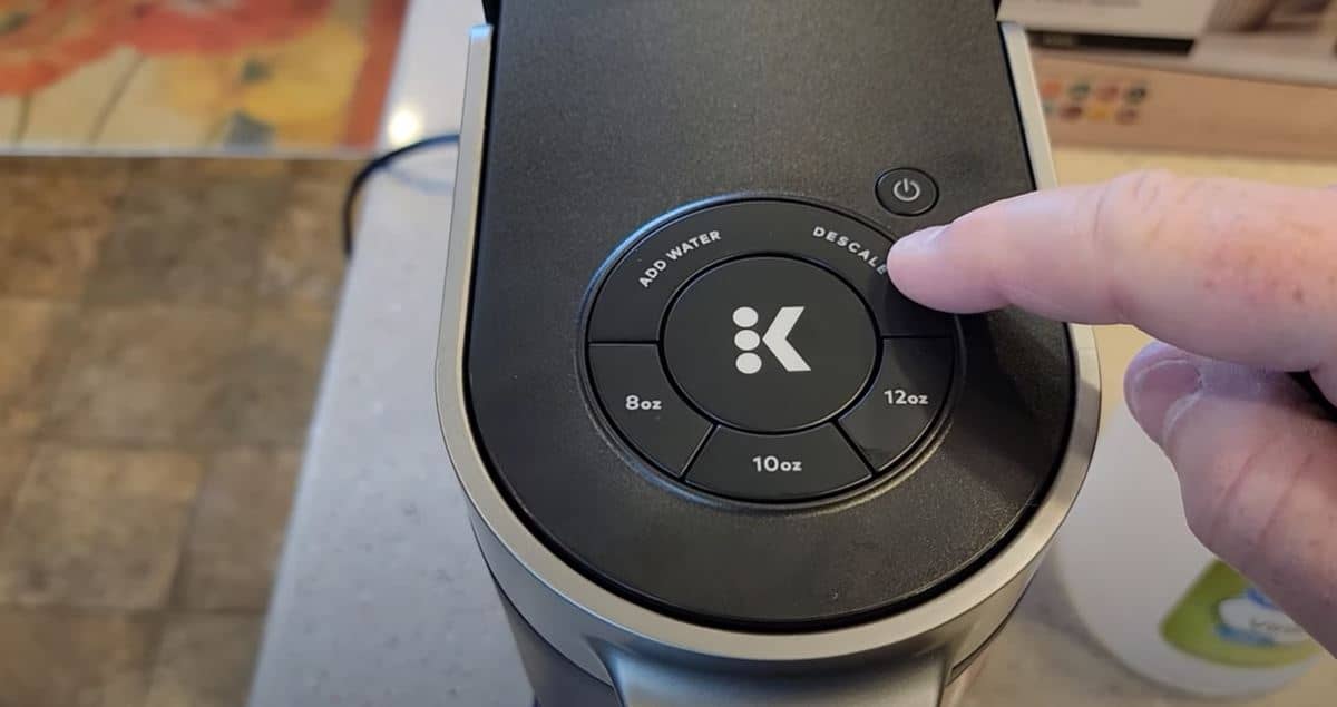 finger on keurig slim buttons