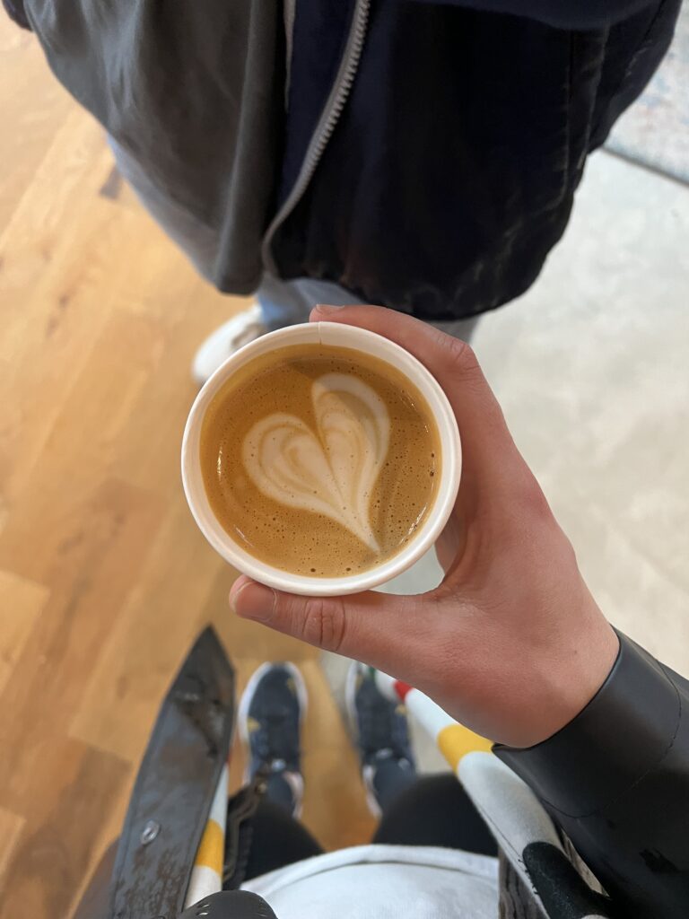 holding coffee latte